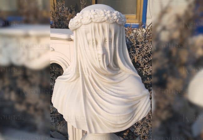 Bust of veiled lady wearing garland sculpture