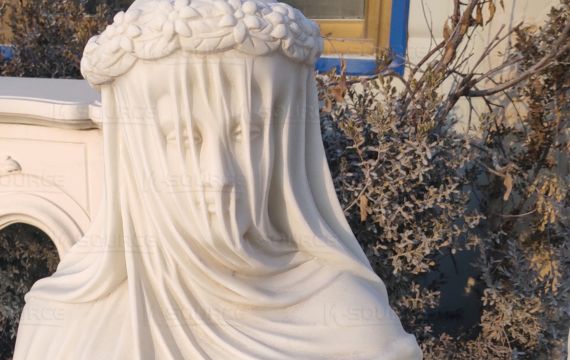 one veiled young woman sculpture