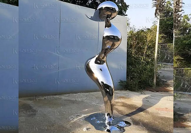 A metal sculpture made of stainless steel, the shape is an abstract human being