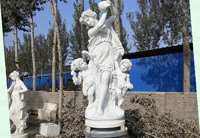 The first sight of this marble statue of a dancing mother and child is vivid and delicate. 