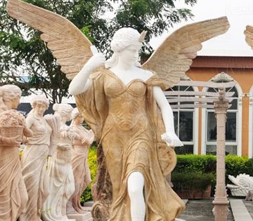 This female garden statue is a beautiful pair of sculptures