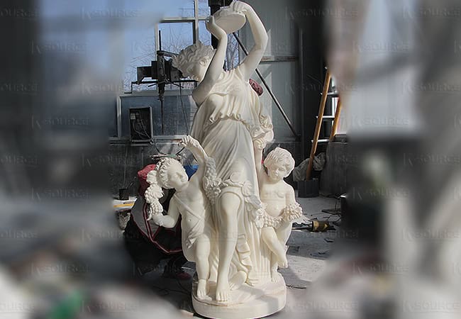 A mother dancing with her two little boys holding a rattle in her hands.
