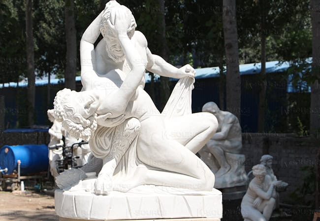 Nude marble statues of man and woman