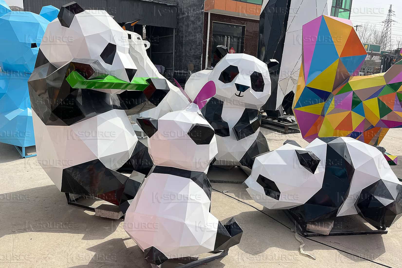 The stainless steel panda sculpture is composed of geometric sections and has a metallic aesthetic.