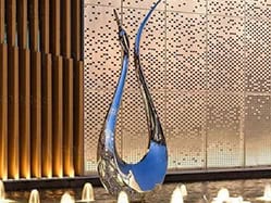 Swans like water, so you can combine this metal swan sculpture with water features