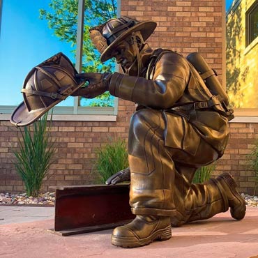 Kneeling firefighter statue